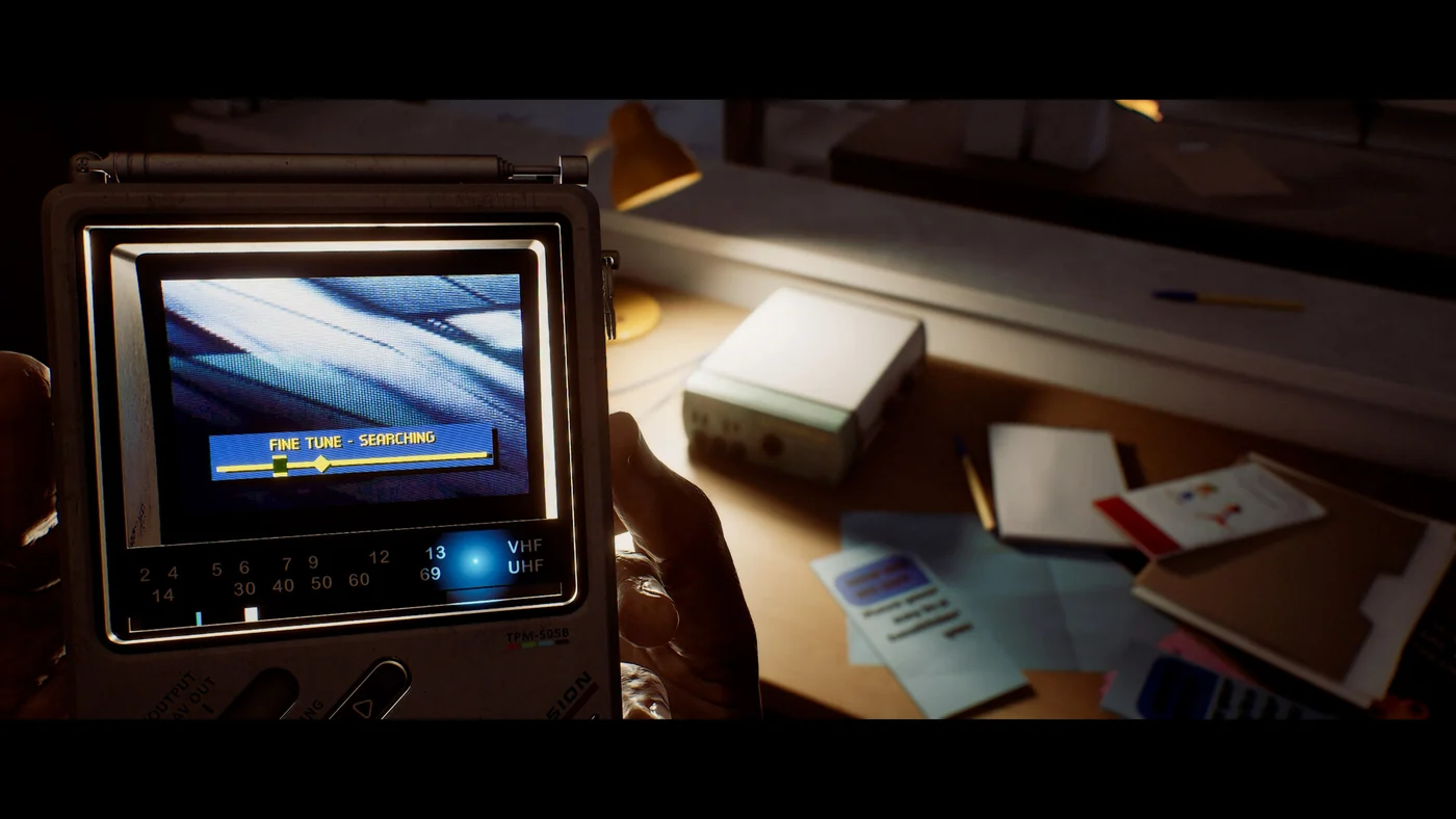 SILENT HILL: Townfall shows a pocket CRTV showing static beside a notepad and pencil.
